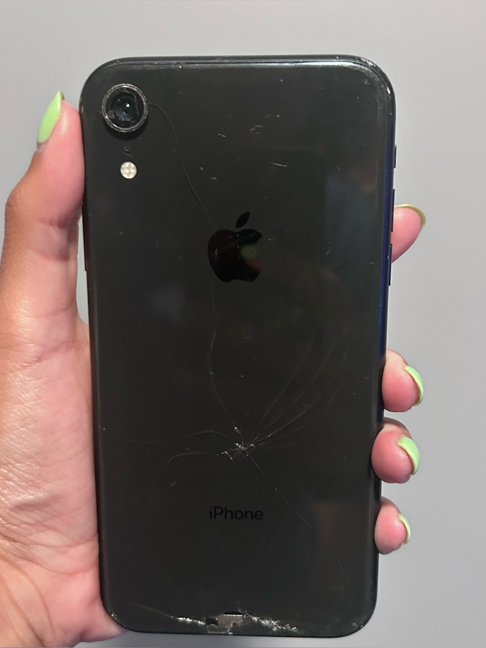 Apple Black Front-Facing Smartphone with Minor Screen Crack